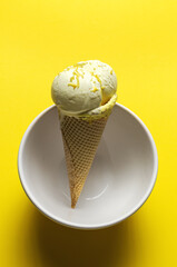 Homemade and refreshing natural lemon ice cream ball in cone