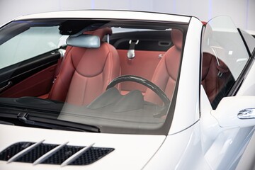 Luxury convertible car with red leather seats