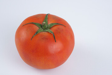 Big red tomato on a white background