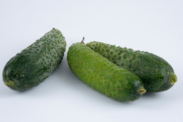 Organic cucumbers on a white background