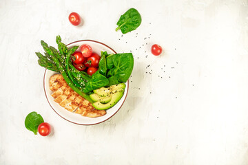Tasty grilled chicken fillet with asparagus and cherry tomato, avocado on white, banner menu recipe place for text. top view
