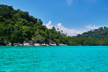Turquoise sea, rain forest, rocks, ocean. Exploring tropical paradise island. Perfect getaway. Relaxing. Travel concept and idea. Beautiful azure ocean.