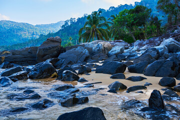 Beach landscape with huge boulders on a beach. Tioman Island, Malaysia.