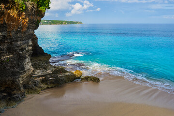 Amazing beach sunset. Turquoise sea, rocks, ocean. Perfect getaway. Relaxing. Beautiful azure ocean.Tropical beach at sunset.Nature landscape background with copy space for text.