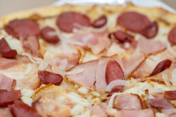 Big pizza close-up topping in a box