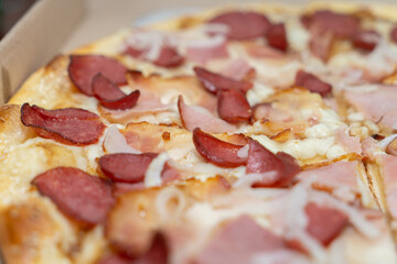 Big pizza close-up topping in a box