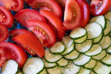 sliced cucumbers and tomatoes in a plate, texture