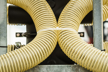 Fototapeta na wymiar Plastic corrugated pipes in agricultural machinery.