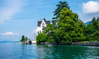 Fototapeta premium View of Lake Lucerne near Gersau town. Swiss Alps in the background. Canton of Schwyz, Switzerland.