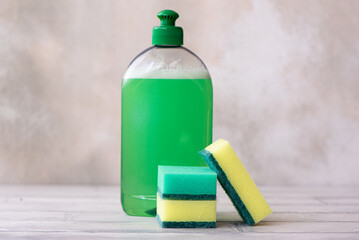 kitchen dishwashing detergent, cleaning powder and sponge