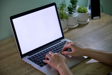 Women working at home, White screen notebook on a wooden table