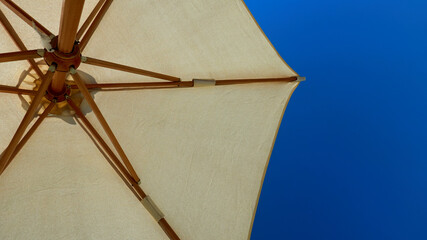 beach umbrellas against the blue sky