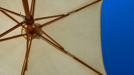 beach umbrellas against the blue sky
