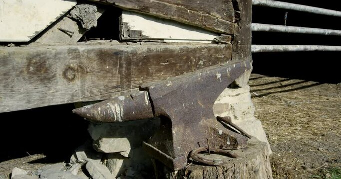 Large anvil outside of barn - tracking out movement