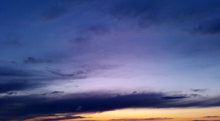 Fototapeta premium dark blue sky with bright orange sunset