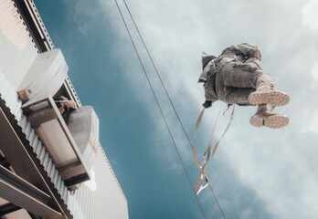 Amazing shot of an airborne forces soldier landing in a mission zone