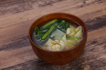 Asian traditional Wonton soup with herbs