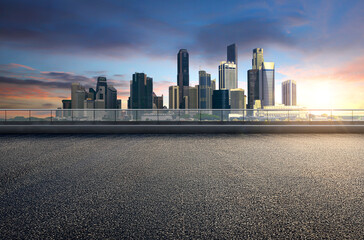 Empty floor platform with sunset view modern city skyline background - obrazy, fototapety, plakaty