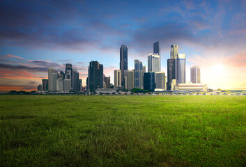 Fototapeta na wymiar Panoramic cityscape with nature grees grass during sunrise