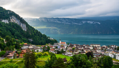 Fototapeta premium View of Lake Lucerne with Gersau town and Swiss Alps in the background. Canton of Schwyz, Switzerland.