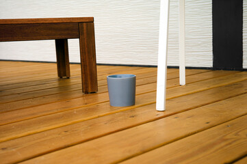 mug placed on a wooden deck
