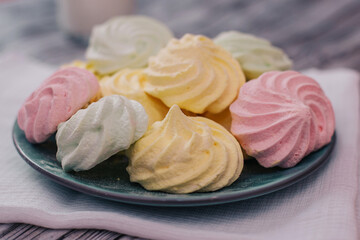 Colorful air marshmallows on a plate. Fresh homemade sweet marshmallows