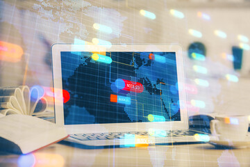 Double exposure of desktop computer and technology theme hologram. Concept of software development.