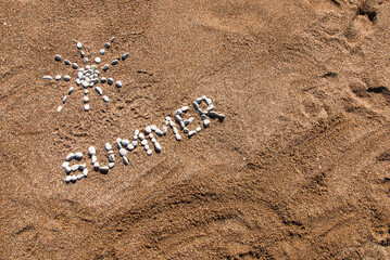 Summer picture from pebble and sand on a beach