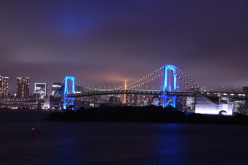Fototapeta na wymiar Blue rainbow bridge in Tokyo