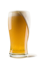 glass of lager beer with overflowing foam on white background