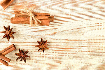 Healthy life style concept with cinnamon, cardamom on wooden surface.