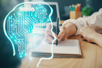 Multi exposure of writing hand on background with brain hologram. Concept of learning.