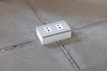 Electrical outlet on the floor.