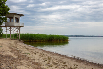 White wooden lifeguard tower on a sandy beach