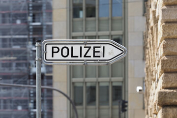 Signpost of the German police station or polizei in Hamburg, Germany