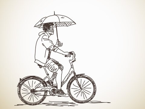 bicyclist with umbrella
