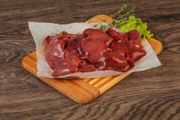 Raw chicken liver over board