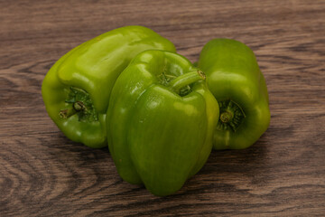 Three green bell juicy peppers