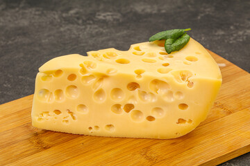 Maasdam cheese - yellow triangle with holes