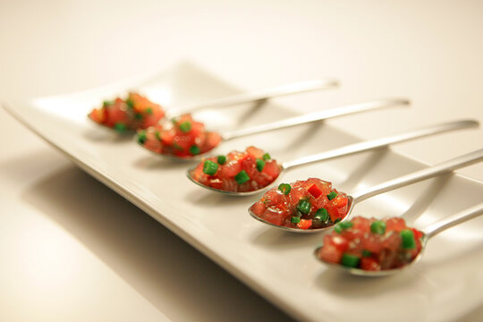 Five teaspoons and tomato salad