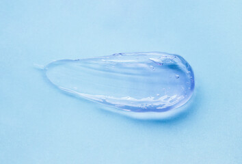 Cream gel blue transparent cosmetic sample on same color background