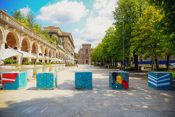 Bergamo, Lombardia, Italy, 16/08/2018, View of the "Sentierone", one of the main streets of Bergamo's movida, with colorful anti-terrorism bollards