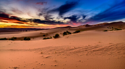 Dramatic and colorful sunset at The Sahara desert: Earth's Largest Hot Desert