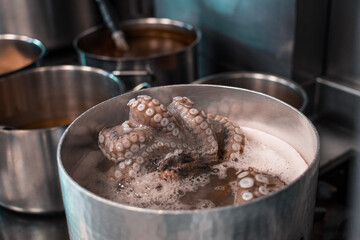 Poulp/octopus boiling in a pan, in a French restaurant