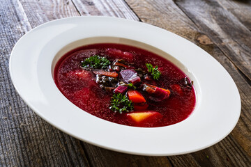 Borsch - beetroots soup on wooden table