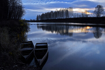 A calm, cool evening on the Sylva River in the area of Podkamennaya Mountain. Autumn in the foothills of the Western Urals.