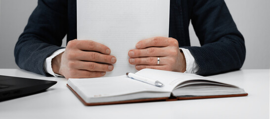 Cropped view of businessman works with financial papers at the table. Finance concept