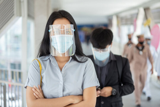 Asian Woman Are Protected By Covid 19, And He Wears A Face Shield Mask.