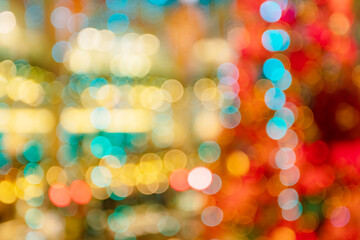 Bright out of focus Christmas lights and falling confetti background