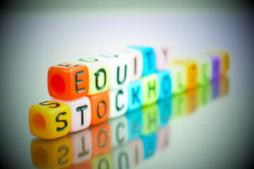 Conceptual of stockholders equity of balance sheet items financial statements spelled on colorful alphabet beads. Isolated over reflective dark background. 